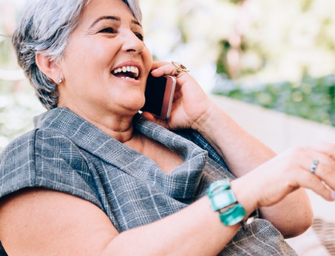 mature woman talking on her cell phone