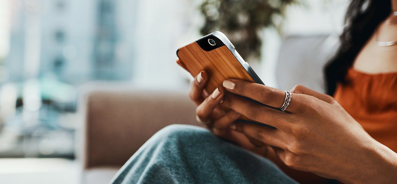 a person holding their mobile device