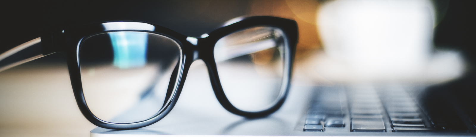 a pair of glasses on a keyboard